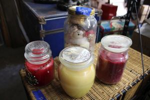 lot 502 image: Scented candles and craft dolls as shown