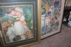 lot 587 image: Wall art Boy kissing girl print and girls with flowers (needs new glass panel)