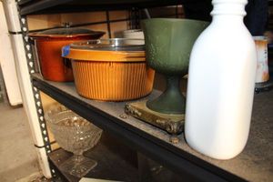 lot 606 image: Crockpots, green glass goblet, and white glass milk bottle