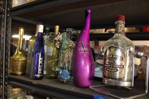 lot 598 image: Empty whiskey and wine bottles