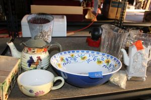 lot 602 image: Ceramic teapots, plastic serving bowl, clear pitchers, and more