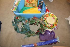 lot 335 image: Tote with Misc. items - wreathes, plastic serving trays, flower flag, jar opener and more