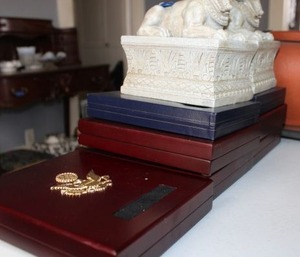 lot 145 image: Empty coin collector case and Egyptian style paper weights