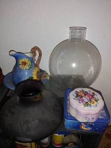 lot 530 image: Glass jars, ceramic flower pitcher, and tins