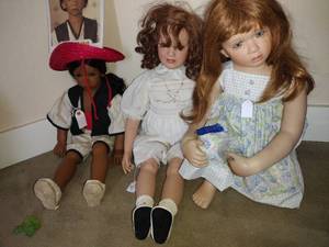 lot 324 image: 2 Porcelain dolls and one Poncho plastic doll, see photos
