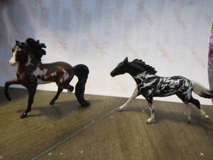 lot 44 image: 2 miniature Breyer horses 1 has a broken leg