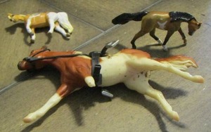 lot 159 image: BREYER MINITURE HOSES  qty 3  ( 2 ARE 2 X 1  & SMALL CHESTNUT PINTO W SADDLE SEE PICTURE OF FRONT LEG )