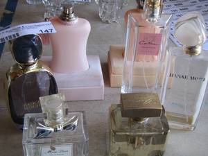 lot 147 image: empty perfume bottles used for dcor , various brands