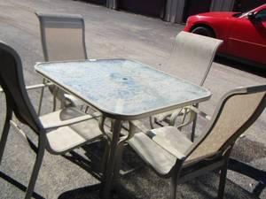 lot 9 image: Glass Top Patio table with  4 Chairs