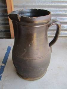 lot 21 image: TOBACCO STAINED POTTERY PITCHER has some Chips 19201930S