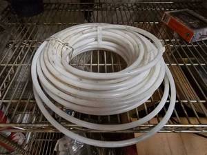 lot 174 image: Large Pole of 38 OD White Nylon Hose.  Approx 50