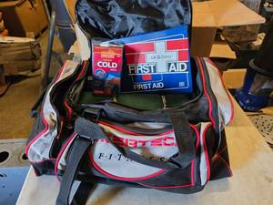 lot 323 image: Car Travel Safety Kit.  Includes Bag, First Aid, Blanket, Flashlight & Emergency Blanket