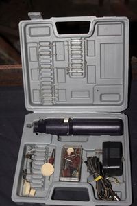 lot 157 image: Rechargeable Rotary Tool And Bits in Case