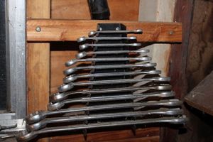 lot 175 image: Set Of Wrenches And Holder. Holder Must Be Unscrewed From Wall