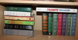 lot 81 image: Books Variety of Bibles and Readers Digest Select Editions and Hardback Peanuts Book