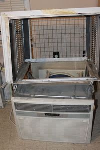 lot 88 image: Fridge dare Window Air Conditioner Unit, Cover Needs put back on