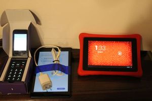 lot 280 image: Large Button Cell Phone, Kindle and Tablet... see Photos
