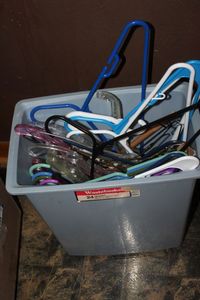 lot 430 image: Plastic Trash Can Full of Hangers