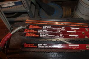 lot 259 image: Bow saw with several Unused Blades