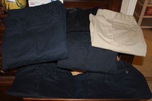 lot 51 image: Variety of Dickies Uniform Pants, One Pair of Shorts and One Pair of Jeans