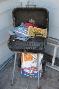 lot 53 image: Charcoal BBQ Grill, Kingsford Charcoal, BBQ Cookbook, Apron and Long Handles TongsSpatula