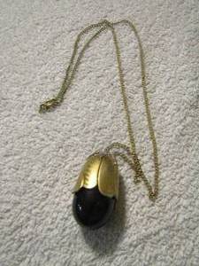 lot 98 image: Avon perfume necklace