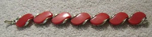 lot 169 image: Lisner red Lucite bracelet silver tones