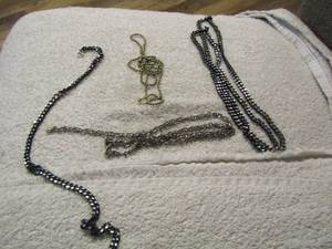 lot 132 image: silver and black color necklaces