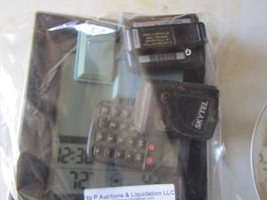 lot 209 image: old school beepers- calculators