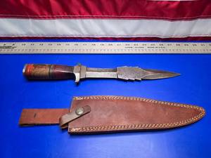 lot 53 image: State of Oklahoma Seal 1907 Damascus Steel Handmade Double Edge Reverse Triple Eared Knife w Layered Exotic Wood Handle & Custom Leather Sheath.  Blade is Approx 10