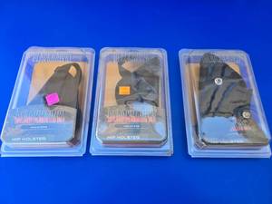 lot 19 image: Lot of 3 Blackhawk Holsters.  1 Right Hand & 2 Left Hand.  Fits 3-4 Barrel