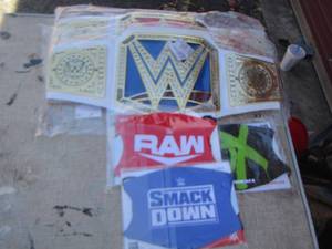 lot 179 image: WWE Wrestling items belts- face masks