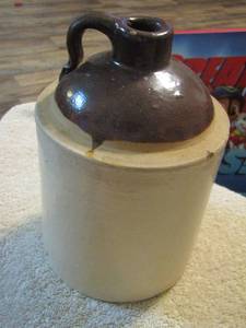 lot 26 image: PRIMITIVE STONEWARE BROWN TOP JUG