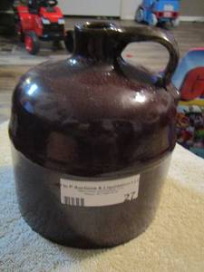 lot 27 image: PRIMITIVE BROWN STONEWARE CROCK JUG