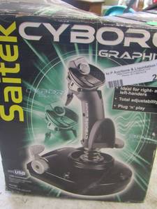 lot 26 image: Cyborg Saitek gaming remote in original box