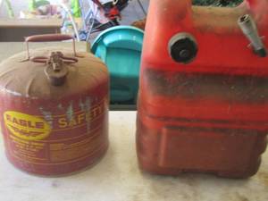 lot 42 image: 2 gas cans one if for a boat the other is a aluminum gas can with lift lid