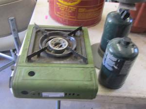 lot 15 image: Coleman camping propane grill with 2 bottles of propane