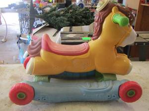 lot 70 image: toddler unisex ride on horse toy needs wiped down