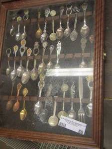 lot 88 image: Glass  display case full of collector spoons from all over the world