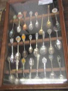 lot 89 image: Glass front display case full of collector spoons from all over the world