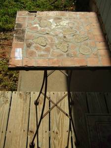 lot 223 image: small outdoor table has a chip