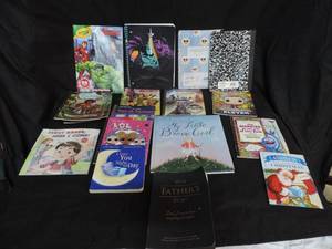 lot 13 image: Lot of books and notebooks a coloring book and also a journal for a father to tell his story