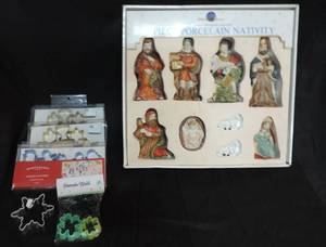 lot 22 image: Cookie cutters and 8 piece porcelain nativity set one is broken see pic only 8 good