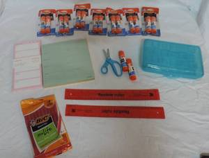 lot 37 image: Elmers school glue  notepad paper calendar  pack of Red pins  two flexible rulers  pencil box and a pair of scissors
