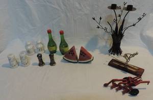 lot 61 image: Assorted salt and pepper shakers  decorative ski guy  decorative candle holder tree and a red farm decoration