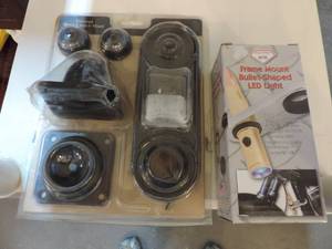 lot 126 image: Frame Mount bullet shaped LED light and universal home and vehicle mount for a gun