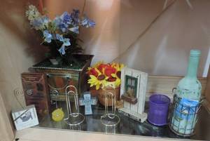 lot 130 image: Mixed lot flower pots with artificial flowers paper clip picture holders fish picture holder sloth picture holder and more see picture for details