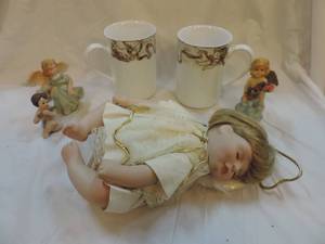 lot 161 image: Porcelain Angel doll small porcelain Angel figures and two cups with cherubs on it