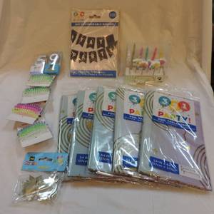 lot 162 image: Party lot  5 unicorn tablecloths some bracelets or hair coils number 5 candle number 9 candle unicorn and star cupcake topper pics and a set of candles