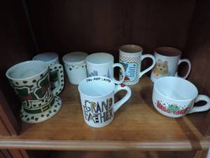 lot 172 image: Mixed lot of coffee cups grandfather you are loved kiss me cup mama bear San Francisco bud St Patricks Day and more